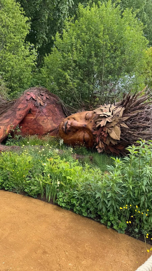Sarah Eberle's On the Edge garden at RHS Chelsea 2026, featuring the Gaia sculpture carved from windfallen trees